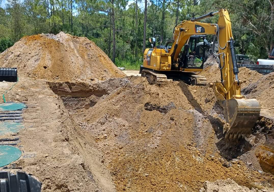 Heavy equipment digging the location to install the septic system